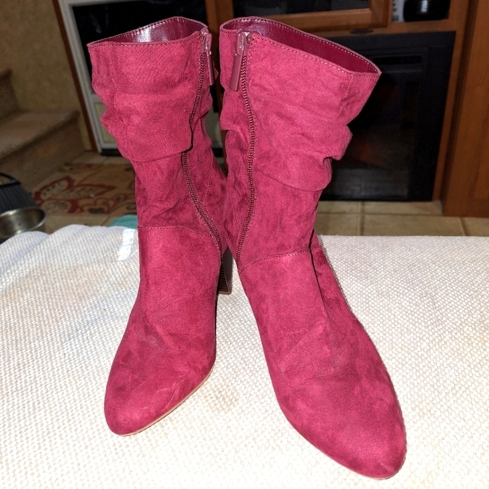 A pair of Kaari Blues Kensie burgundy booties in a ladies size 8.5.